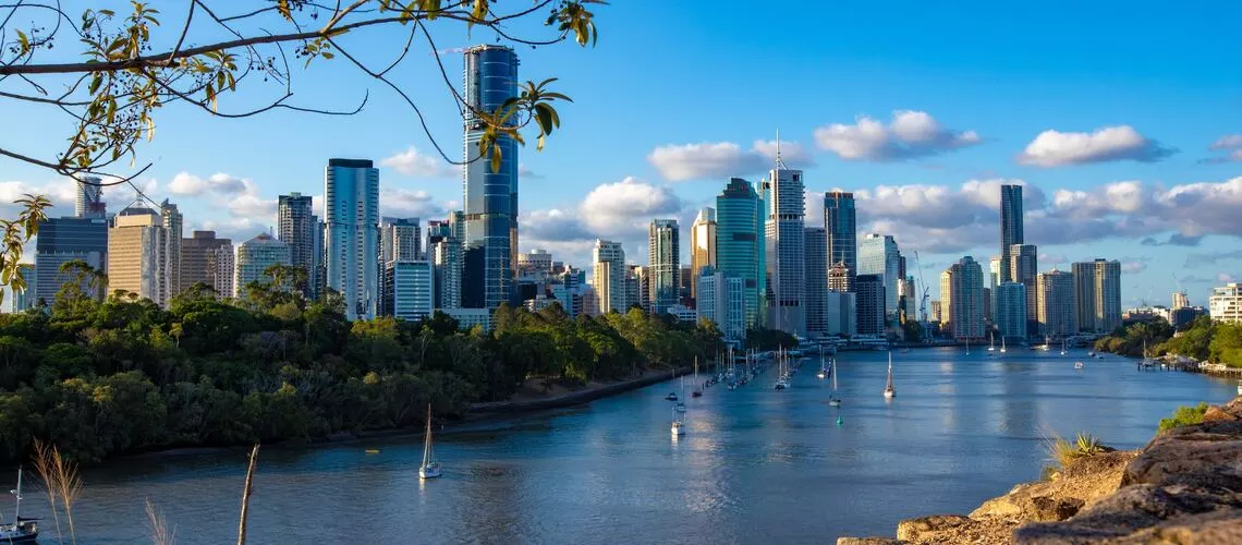 Brisbane skyline with property valuation tools", "Professional property valuer analyzing Brisbane market", "Guide to hiring Brisbane property expert